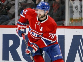 Montreal Canadiens Andrei Markov looks to pass the puck during second period of National Hockey League game against the Florida Panthers in Montreal Tuesday April 5, 2016.