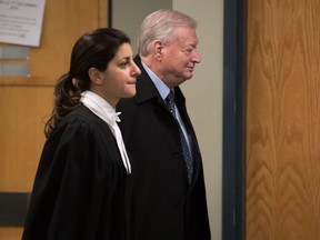 Former Laval mayor Gilles Vaillancourt and his lawyer head to courtroom in Laval on Dec. 1, 2016. Vaillancourt pleaded guilty to fraud, breach of trust and conspiracy charges and was sentenced in to six years in prison.