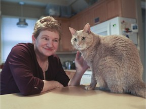 Stephanie Laett and her cat Simba. "I don't even want the city to know I have a cat," the veterinarian says. "To me, you have to encourage good pet ownership."