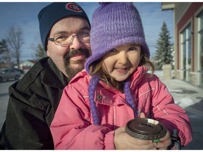 Paul Bradshaw with his 4-year-old daughter Kathryn while out for a hot chocolate in St. Lazare on Sunday, December 11, 2016. Bradshaw's wife is in the U.S. and not allowed to return to Canada. The situation has dragged on for more than a year, and it does not look like she will make it home for Christmas. (Peter McCabe / MONTREAL GAZETTE)