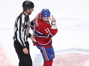 Montreal Canadiens' Brendan Gallagher, right, and lineman Bevan Mills skate away on ice, as Gallagher shouts back at Boston Bruins' Torey Krug, not seen, following fight during first period NHL action in Montreal on Monday December 12, 2016.