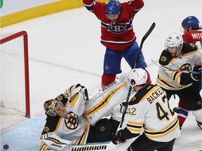Montreal Canadiens' Brendan Gallagher (11) celebrates goal from Montreal Canadiens Paul Byron as he stands above Boston Bruins goalie Tuukka Rask during third period NHL action in Montreal on Monday December 12, 2016.