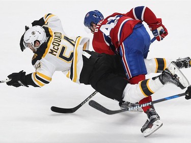 Montreal Canadiens' Paul Byron (41) brings down Boston Bruins' Adam McQuaid (54) during second period NHL action in Montreal on Monday December 12, 2016.