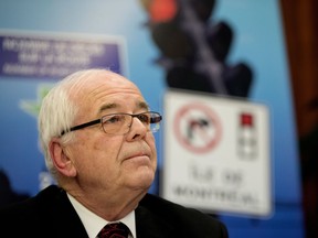 Georges Bourelle, mayor of Beaconsfield, listens to questions during a press conference in Montreal on Tuesday December 13, 2016. Mayors from 5 municipalities spoke in favour of allowing right on red turning in their cities.