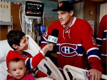 Elowan Gingras interviews Montreal Canadiens centre Andrew Shaw during the Montreal Canadiens annual visit to the Shriner's Hospital for Children in Montreal on Wednesday Dec. 14, 2016. Gingras told the Canadiens his dream is to become a hockey analyst, TVA turned the microphone over to Gingras for him to conduct his first hockey interview.