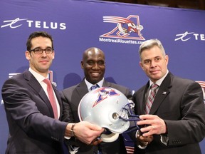 Montreal Alouettes' president Patrick Boivin, left, GM Kavis Reed and head coach Jacques Chapdelaine are all smiles during a news conference on Wednesday announcing the club's front office shuffle.