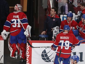 Canadiens goalie Carey Price looks toward the team's bench after being pulled from the game after a goal by San Jose Sharks' Melker Karlsson during second period NHL action in Montreal on Friday, Dec. 16, 2016.