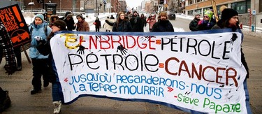 MONTREAL, QUE.: DECEMBER 18, 2016-- A group of people march along Berri street in Montreal on December 18 2016. The group walked 16 kilometres to protest against the Enbridge Line 9 pipeline and Bill 106, which gives companies the right to expropriate land to extract oil. (Allen McInnis / MONTREAL GAZETTE) ORG XMIT: 57810