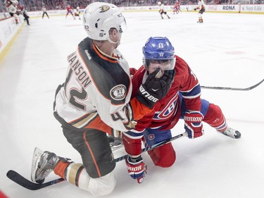 Montreal Canadiens Brendan Gallagher gets a glove to the face from Anaheim Ducks Josh Manson after a scuffle in the corner during first period of National Hockey League game in Montreal Tuesday Dec. 20, 2016.