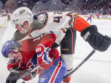 Montreal Canadiens Brendan Gallagher is roughed up by Anaheim Ducks Josh Manson during first period of National Hockey League game in Montreal Tuesday Dec. 20, 2016.
