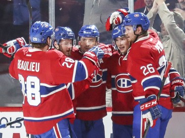 Montreal Canadiens, from left, Nathan Beaulieu, Paul Byron, Tomas Plekanec, Artturi Lehkonen and Jeff Petry celebrate Plekanec's goal during second period of National Hockey League game against the Anaheim Ducks in Montreal on Tuesday.