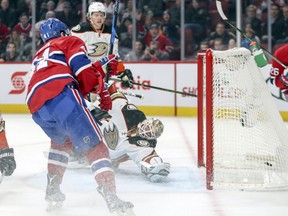 Canadiens' Paul Byron shoots the puck past Ducks goalie Jonathan Bernier for the Habs' first goal Tuesday night at the Bell Centre.