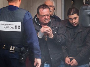 Raynald Desjardins, left, exiting the Joliette courthouse, north of Montreal, on Wednesday December 21, 2011. Desjardins is charged with the first-degree murder of Salvatore (Sal the Ironworker) Montagna, and Racaniello is charged with murder and conspiracy in the Montagna case.
