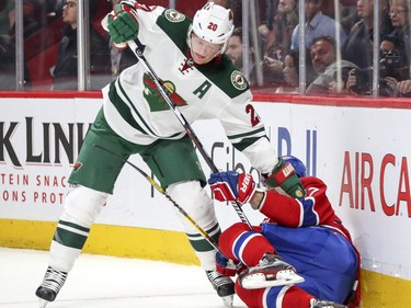 Minnesota Wild defenceman Ryan Suter holds down Montreal Canadiens Alexander Radulov during first period of National Hockey League game in Montreal Thursday Dec. 22, 2016.