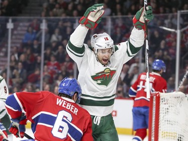 Minnesota Wild Jason Zucker celebrates goal by teammate Jared Spurgeon next to Montreal Canadiens Shea Weber during second period of National Hockey League game in Montreal Thursday Dec. 22, 2016.