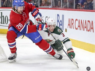 Minnesota Wild's Charlie Coyle, right, knocks the puck off of Montreal Canadiens Jeff Petry's stick during second period of National Hockey League game in Montreal Thursday Dec. 22, 2016.