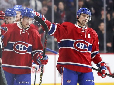 Montreal Canadiens Artturi Lehkonen gets a pat on the head from teammate Tomas Plekanec after scoring goal against the Minnesota Wild during second period of National Hockey League game in Montreal Thursday Dec. 22, 2016.