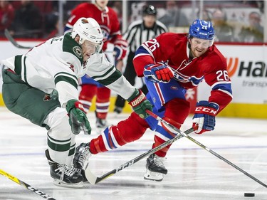 Montreal Canadiens Jeff Petry, right, chases down Minnesota Wild's Charlie Coyle during second period of National Hockey League game in Montreal Thursday Dec. 22, 2016.