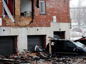 A car was crushed by debris from an apartment building fire in LaSalle Dec. 23, 2016.