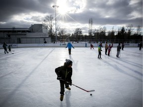 Local hockey players take part in pick-up hockey at Confederation park in NDG on Wednesday December 28, 2016. Montreal is planning to invest in more refrigerated outdoor rinks, like Toronto, because global warming is shrinking the skating season. Toronto has 52 refrigerated outdoor rinks while Montreal has eight.