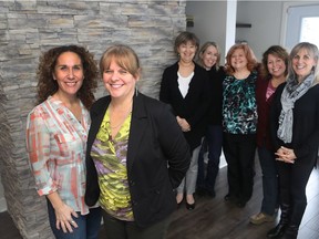 Executive director Debbie Magwood, second from left, and marketing director Serena Chenoy, left, stand with staff members: Denyse Boivin, Louise J. Bilodeau, Lisa Rossi, Maggie Costa and, far right, Barbara Truman-Grant in the new West Island Cancer Wellness Centre on December 9, 2016. They will host an open house at the new facility Dec. 9, from 10 a.m. to 1 p.m. (Marie-France Coallier / MONTREAL GAZETTE)