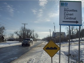 A truck travels down Harwood Road between Highway 20 and Highway 40 in Vaudreuil-Dorion, on Tuesday, December 6, 2016. The town of Vaudreuil-Dorion is asking Quebec to pay half the cost of reconstructing the road, recently named as one of the worst in the region by a CAA poll. (Peter McCabe / MONTREAL GAZETTE)