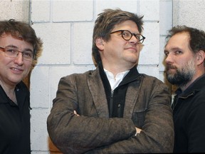 Conductor Alain Trudel, left, director Dominic Champagne and composer Julien Bilodeau get up against the wall at Place des Arts on Tuesday, Dec. 6, 2016 after the first rehearsal of Another Brick in the Wall: The Opera.