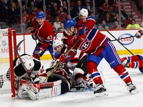 Canadiens centre Andrew Shaw tries to get to the puck as Devils defenceman Ben Lovejoy covers up while goalie Cory Schneider is down during NHL action at the Bell Centre in Montreal on Thursday December 8, 2016.