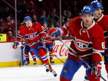 Montreal Canadiens defenceman Nathan Beaulieu, left, takes part in the pre-game warmup during NHL action against the New Jersey Devils at the Bell Centre in Montreal on Thursday December 8, 2016.