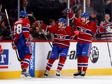 Montreal Canadiens defenceman Nathan Beaulieu, left to right, Montreal Canadiens centre Andrew Shaw and Montreal Canadiens left wing Artturi Lehkonen celebrate scoring against the New Jersey Devils during NHL action at the Bell Centre in Montreal on Thursday December 8, 2016.