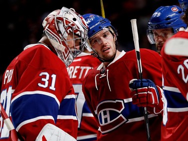 Montreal Canadiens goalie Carey Price is congratulated by Montreal Canadiens centre Torrey Mitchell during NHL action at the Bell Centre in Montreal on Thursday December 8, 2016. Mitchell scored two goals against New Jersey Devils goalie Cory Schneider.