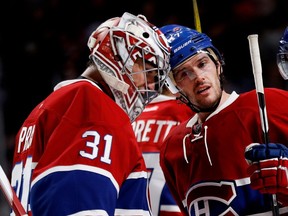 Canadiens goalie Carey Price is congratulated by centre Torrey Mitchell during NHL action at the Bell centre in Montreal on Thursday Dec. 8, 2016.