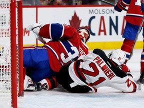 Devils right-winger Kyle Palmieri crashes into Canadiens goalie Carey Price during NHL action at the Bell Centre in Montreal on Thursday December 8, 2016.