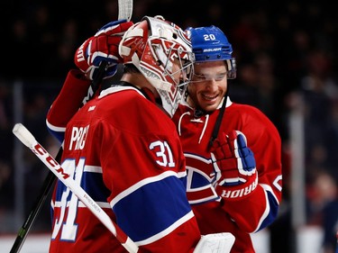 Rookie Montreal Canadiens defenceman Zach Redmond congratulates Montreal Canadiens goalie Carey Price after beating the New Jersey Devils during NHL action at the Bell centre in Montreal on Thursday December 8, 2016.