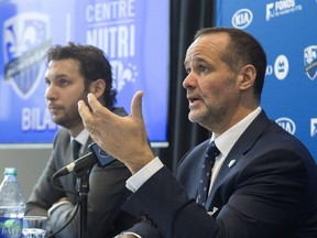 Joey Saputo, President of the Montreal Impact, right, with team technical director Adam Braz, speaks to journalists at the team's training facility, Friday December 9, 2016, about his team's 2016 performance.