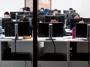 Vocational students work in a computer lab at a downtown campus of the Lester B. Pearson School Board on Friday Dec. 9, 2016.