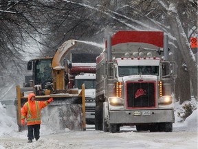 A snow removing crew works on Kensington Ave. in Montreal Wednesday, January 7, 2015.