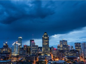 The Montreal city skyline as storm clouds approach the region of Montreal on hot summer evening on Sunday, July 19, 2015.