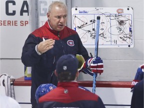 Montreal Canadiens head coach Michel Therrien talks with his team at practice at the Bell Sports Complex in Brossard near Montreal Tuesday, November 1, 2016.