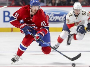 Montreal Canadiens Paul Byron skates with the puck away from Florida Panthers Denis Malgin during first period of National Hockey League game in Montreal Tuesday November 15, 2016.