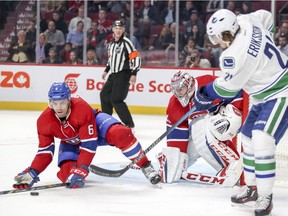 Montreal Canadiens Shea Weber, right, blocks centring pass by Vancouver Canucks Loui Eriksson in front of goalie Carey Price during second period of National Hockey League game in Montreal Wednesday November 2, 2016.