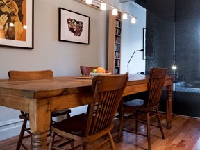 Geneviève Meloche and her husband Leopold Ste-Marie bought this 1908 duplex for $114,000 in 1997 as an investment. The couple now own only the 1,000-square-foot upper unit. Opening the living room dining room area in the Montreal condo, on Friday, November 25, 2016 makes the space feel much bigger than it is. (Dave Sidaway / MONTREAL GAZETTE)