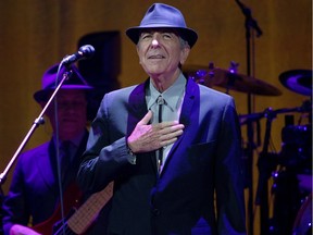 Montreal singer Leonard Cohen acknowledges cheers of the crowd as he takes the stage for his concert at the Bell Centre on Nov. 28, 2012.