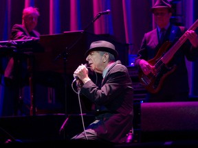Montreal native Leonard Cohen drops to his knees as he sings Dance Me To The End Of Love during his performance at the Bell Centre in Montreal Nov. 28, 2012.