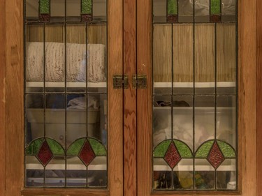 A detailed view of the built-in cupboards with glass doors at the apartment of Marie-Thérèse Nichele in Plateau-Mont-Royal.