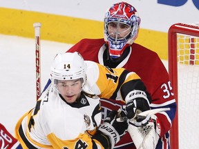 Montreal Canadiens goalie Al Montoya tries to push away Pittsburgh Penguins left wing Chris Kunitz during first period NHL action in Montreal on Tuesday October 18, 2016.