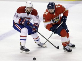 Montreal Canadiens' Phillip Danault, left, battles Florida Panthers centre Seth Griffith for the puck during the second period on Dec. 29, 2016, in Sunrise, Fla.
