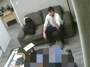 Police surveillance video of undercover RCMP officer, blurred to protect his identity, speaking to Ismael Habib.  Habib is on trial in Montreal for trying to leave Canada to commit terrorist acts.