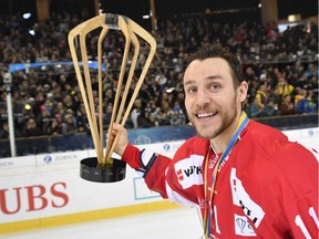 Team Canada's Gregory Campbell reacts with the Spengler Cup Trophy after the final game between Team Canada and HC Lugano, at the 90th Spengler Cup ice hockey tournament in Davos, Switzerland, Saturday, Dec. 31, 2016.