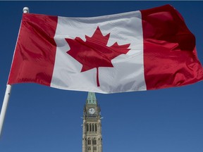 The Canadian Flag flies over the Peace Tower on Parliament Hill on the 50th anniversary of the Canadian Flag in Ottawa on Sunday, Feb. 15, 2015.